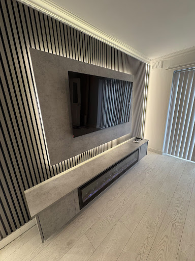 Charcoal and acoustic oak slat contemporary media wall